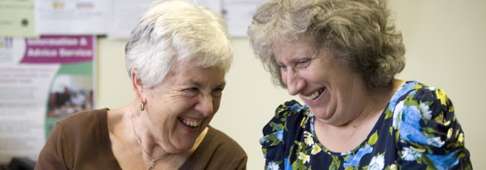 Older women, 60s-70s chatting, laughing